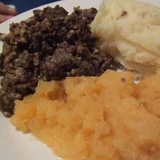 Haggis served with mashed swede and potatoes